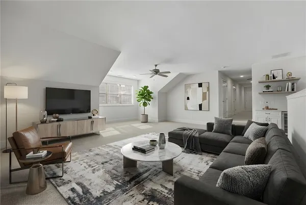 a living room with furniture and a flat screen tv