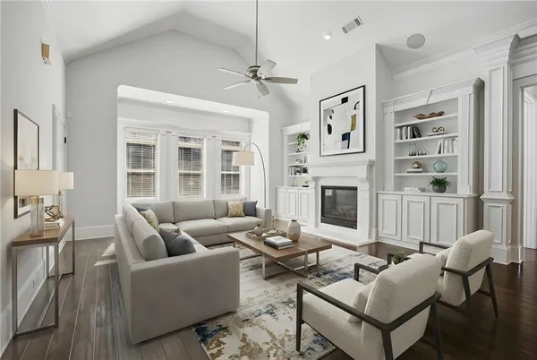 a living room with furniture windows and a fireplace