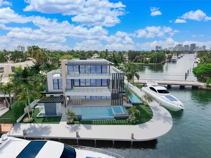 a view of a lake with a house in the background