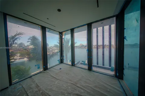 a view of a room with furniture and window