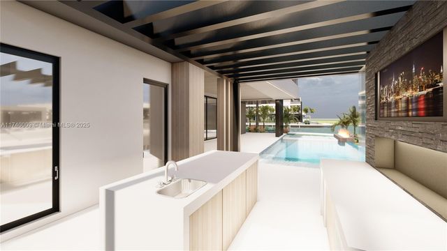 a kitchen with stainless steel appliances granite countertop a sink a stove and a refrigerator