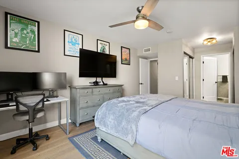 a bathroom with double vanity sinks and a mirror