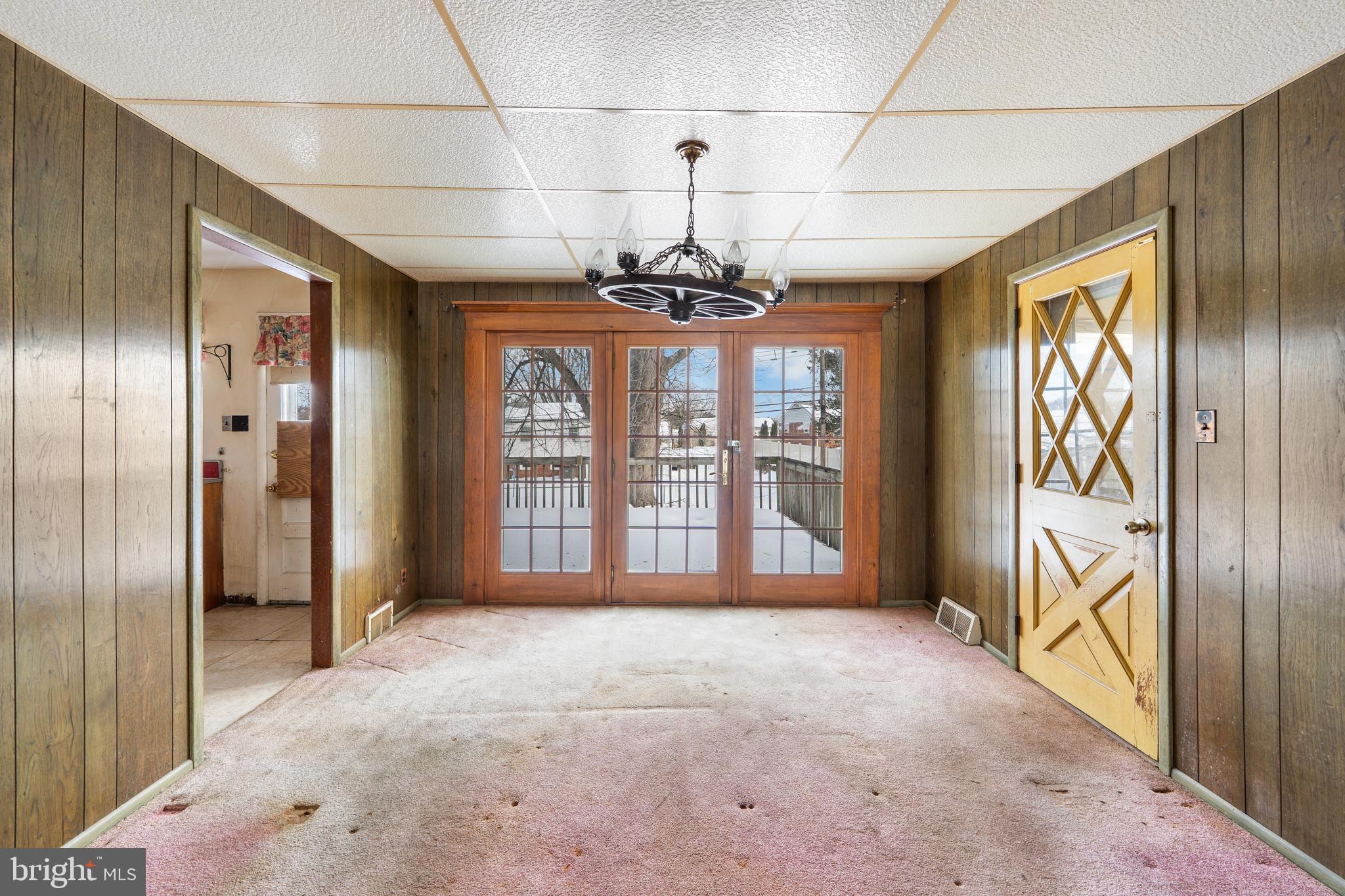 112 Butt Lane Aston, PA 19014 - Photo 12 of 24 a view of a room with large windows and chandelier