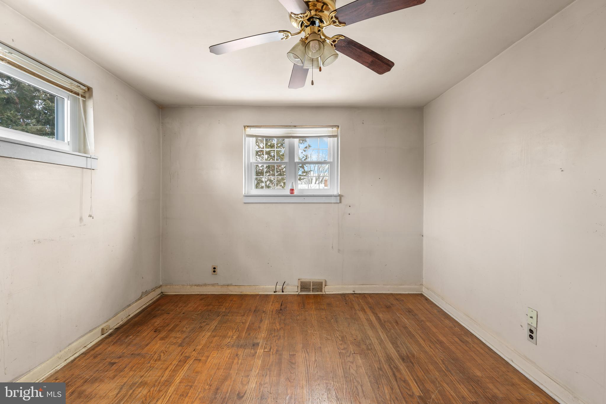 112 Butt Lane Aston, PA 19014 - Photo 13 of 24 wooden floor in an empty room with a window