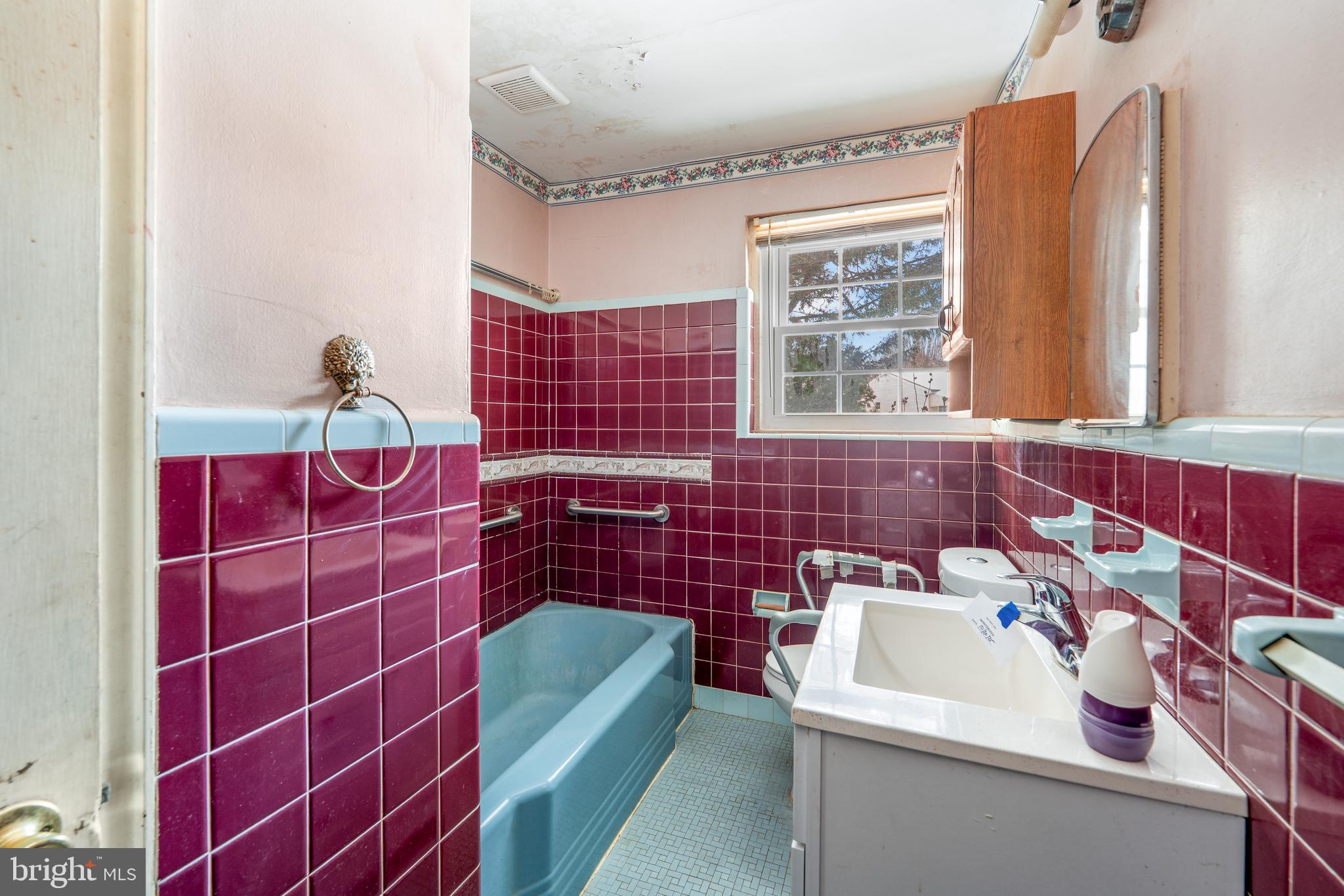 112 Butt Lane Aston, PA 19014 - Photo 14 of 24 a bathroom with a sink a toilet and window
