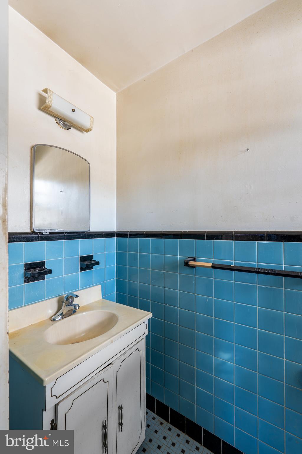 112 Butt Lane Aston, PA 19014 - Photo 17 of 24 a bathroom with a sink a toilet and a mirror
