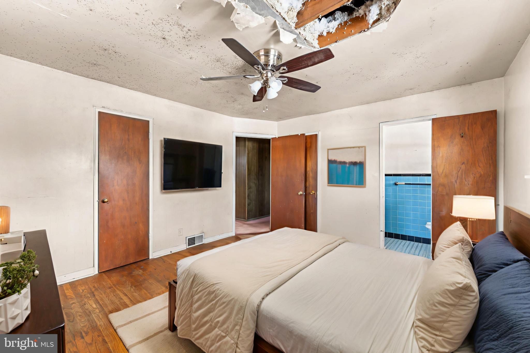 112 Butt Lane Aston, PA 19014 - Photo 6 of 24 a bedroom with a large bed and a chandelier