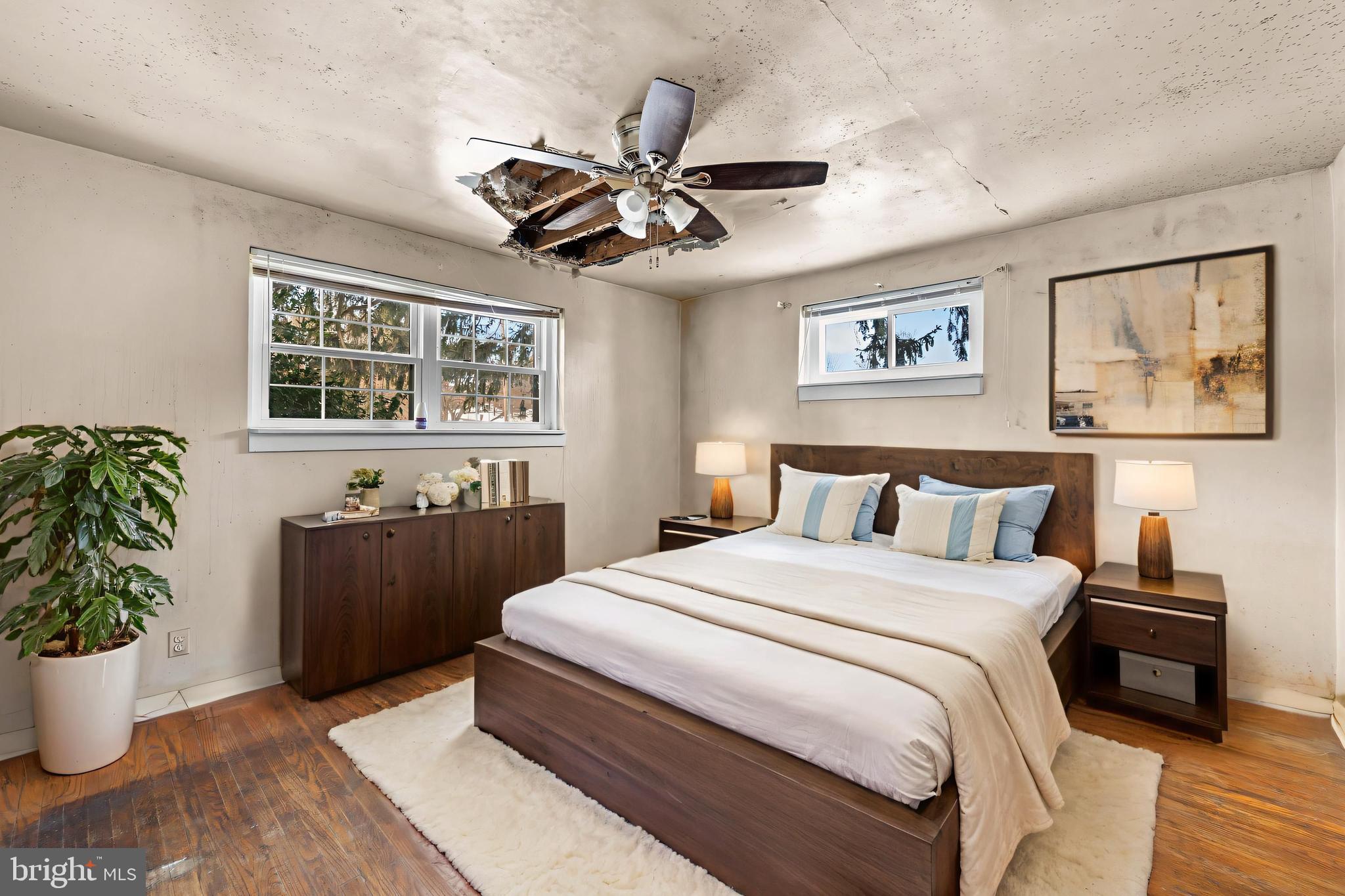 112 Butt Lane Aston, PA 19014 - Photo 7 of 24 a bedroom with a large bed and a chandelier