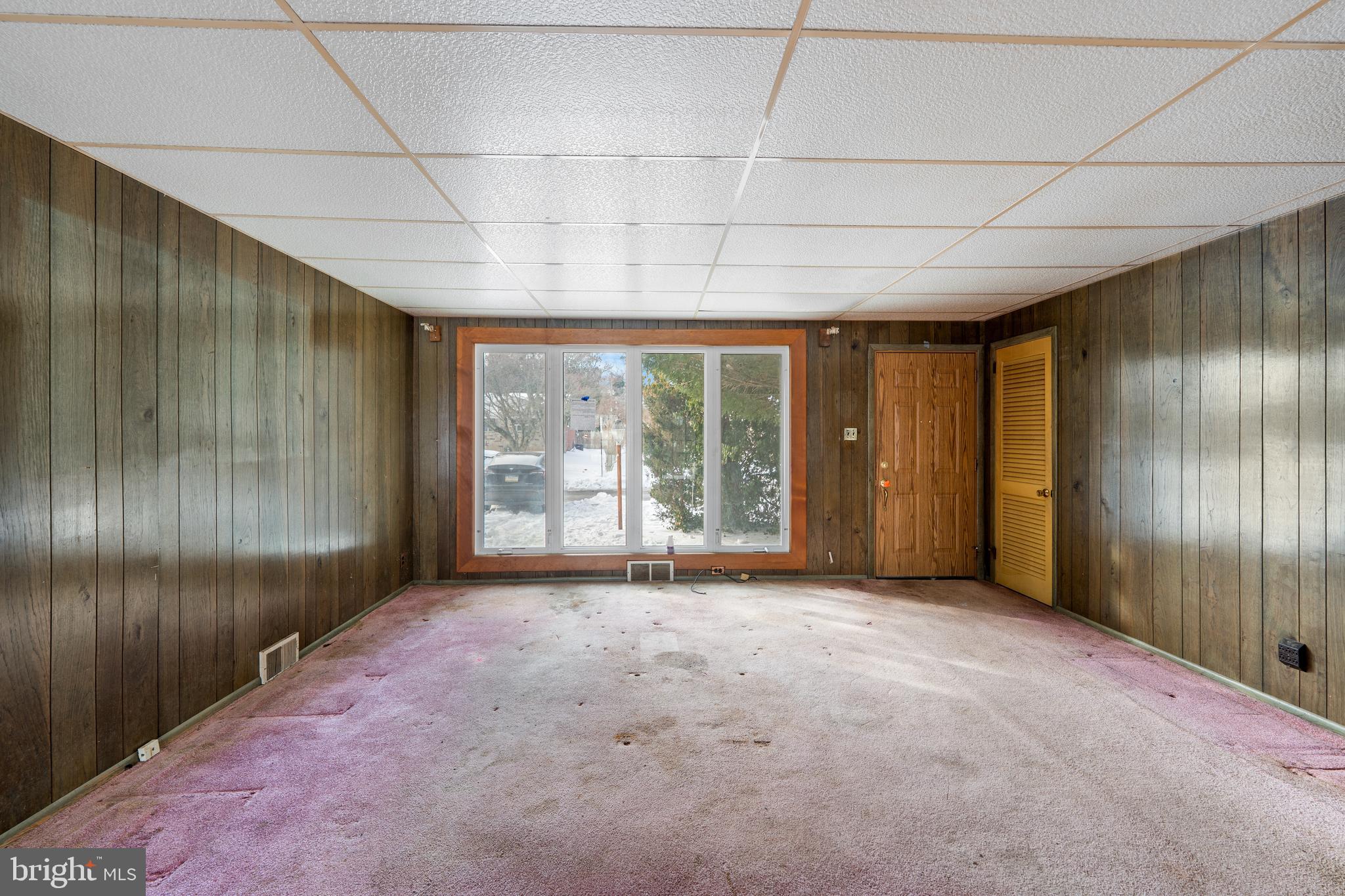 112 Butt Lane Aston, PA 19014 - Photo 10 of 24 a view of empty room with floor to ceiling window