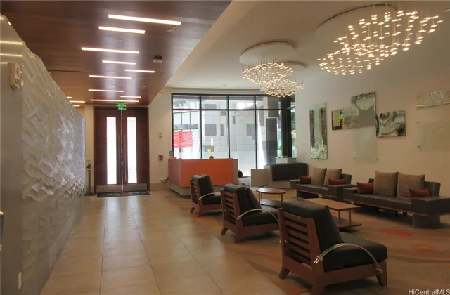 a building outdoor space with patio furniture and potted plants