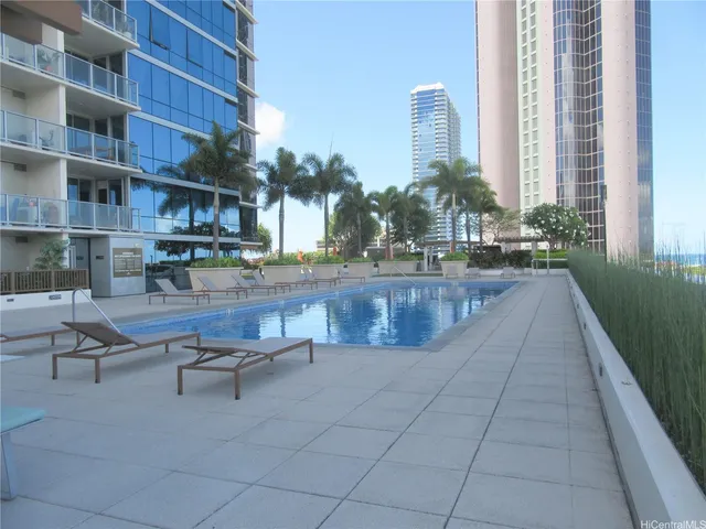 a view of backyard with a table and chairs