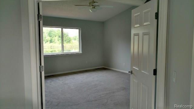 425 Lilly View Court Howell, MI 48843 - Photo 8 of 11 MasterBedroom1WithLakeView.jpg