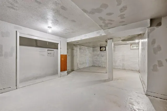 a bedroom with a bed and a shower