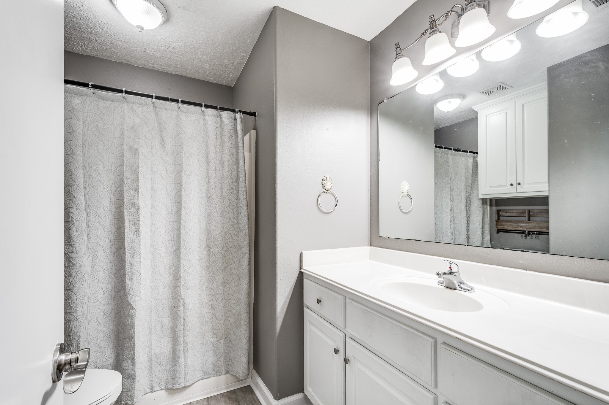16392 Many Trees Lane Conroe, TX 77302 - Photo 23 of 33 Well placed guest bathroom with space and storage