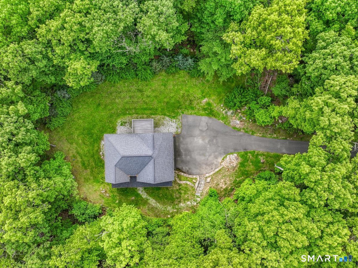 127 Putnam Park Road Bethel, CT 06801 - Photo 29 of 35 an aerial view of a house with a yard and lake view