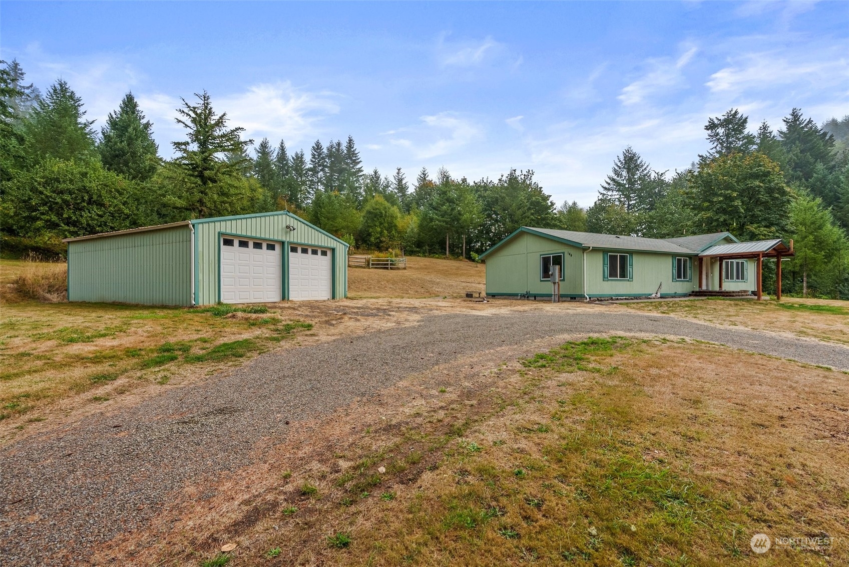 144 Aumick Road Winlock, WA 98596 - Photo 1 of 35 a house with trees in the background