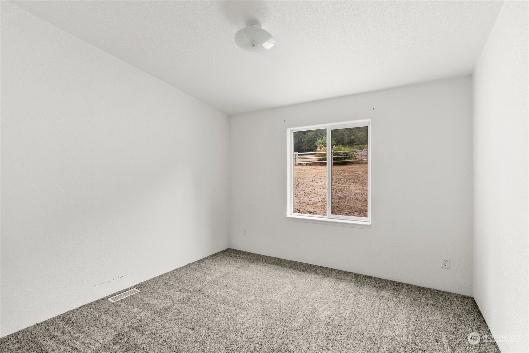 144 Aumick Road Winlock, WA 98596 - Photo 16 of 35 an empty room with a window