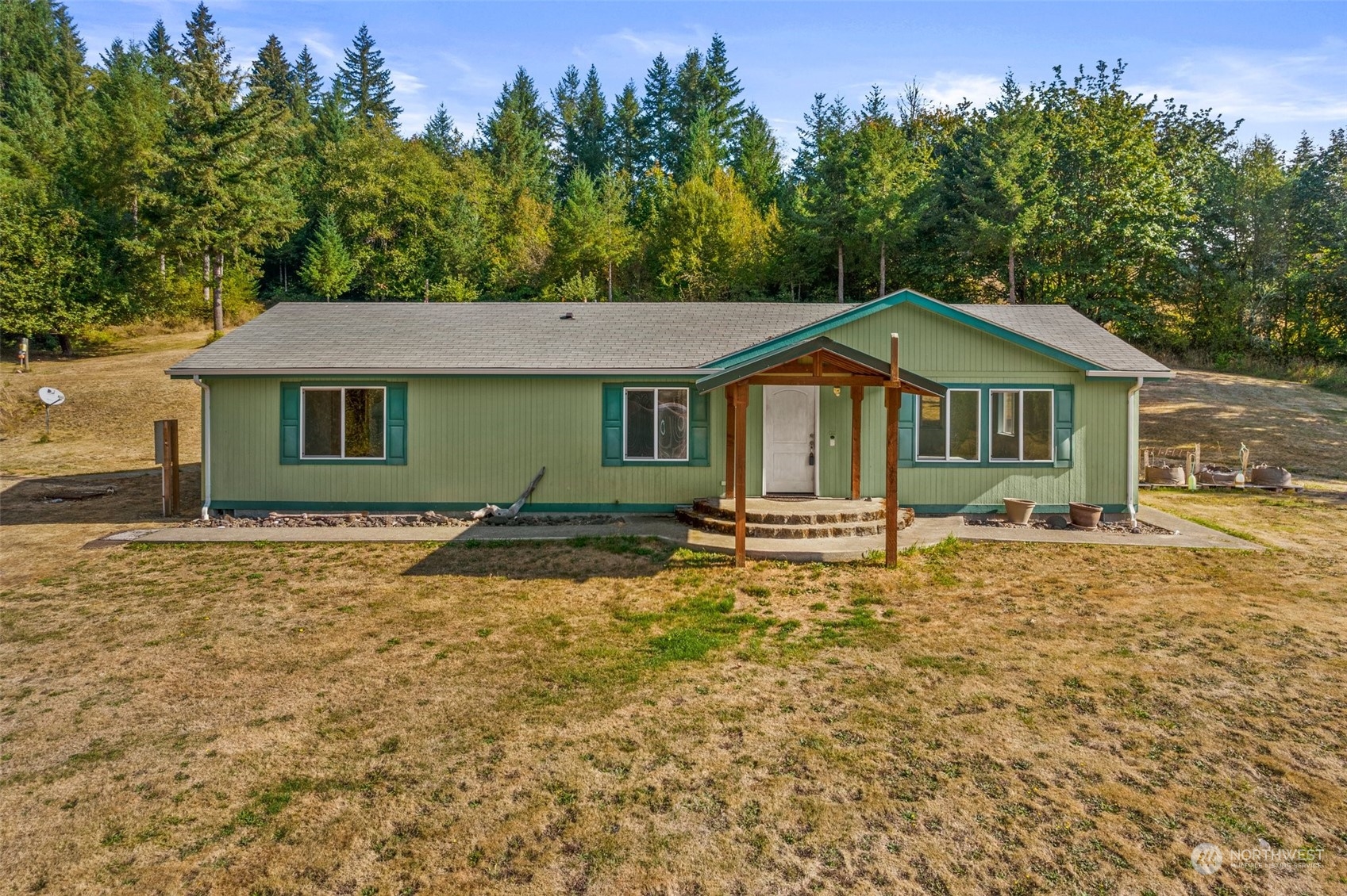 144 Aumick Road Winlock, WA 98596 - Photo 2 of 35 a house with trees in the background