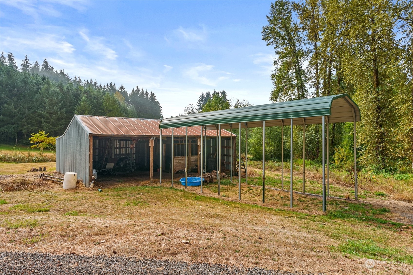 144 Aumick Road Winlock, WA 98596 - Photo 25 of 35 a view of a house with backyard and a tree