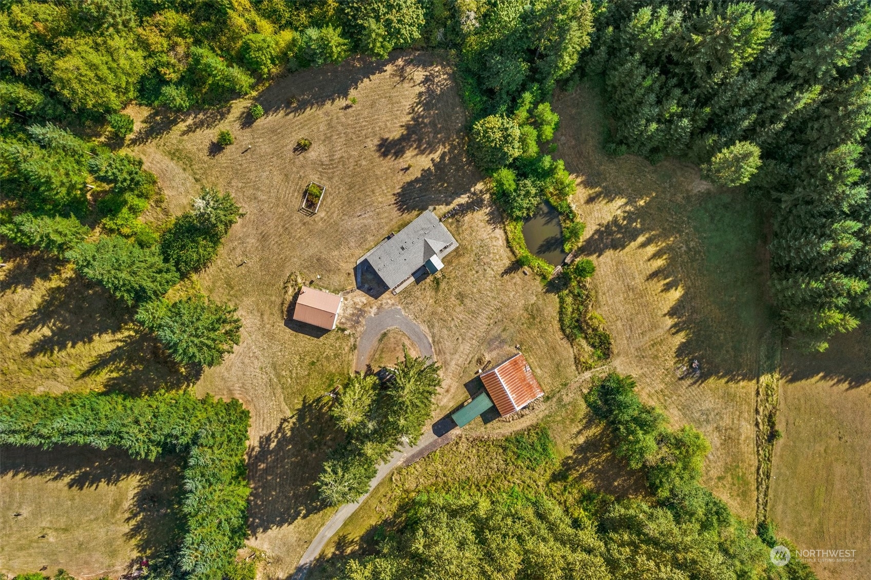 144 Aumick Road Winlock, WA 98596 - Photo 4 of 35 an aerial view of residential house with swimming pool and lawn chairs