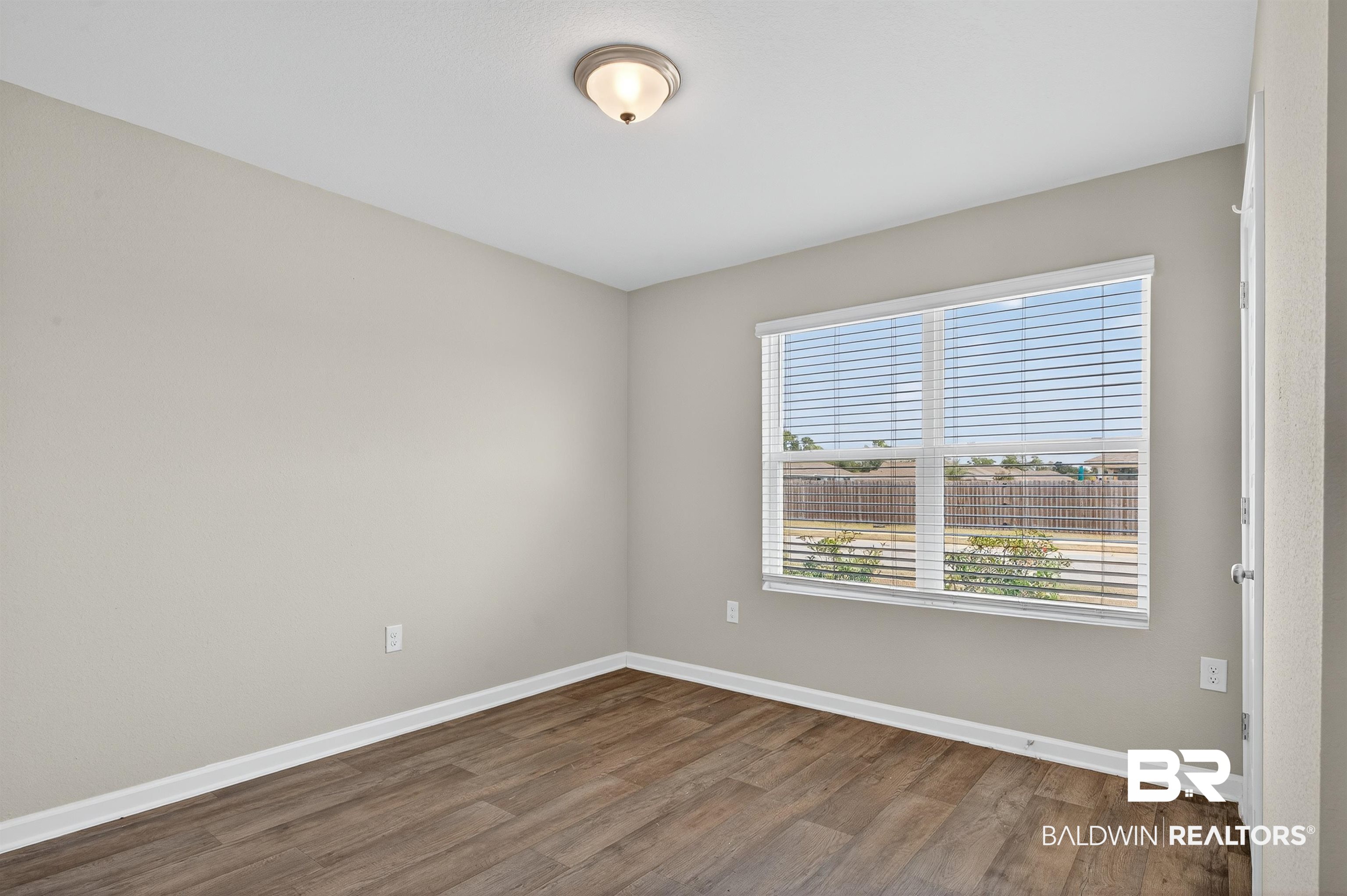 7429 Brompton Drive Foley, AL 36535 - Photo 34 of 50 Unfurnished room featuring wood finished floors and baseboards