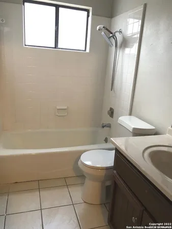 a bathroom with a sink a toilet and a bathtub