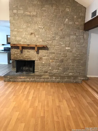 a living room with a fireplace