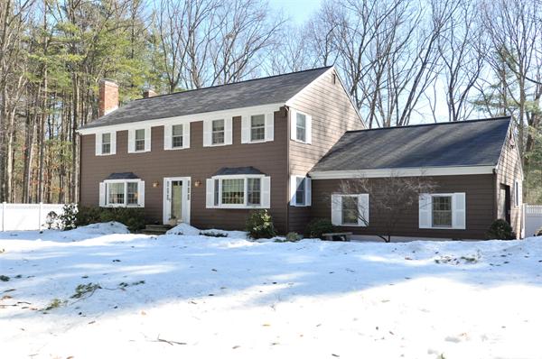 22 Rambling Road Sudbury, MA 01776 - Photo 1 of 1 a front view of a house with a yard covered in snow