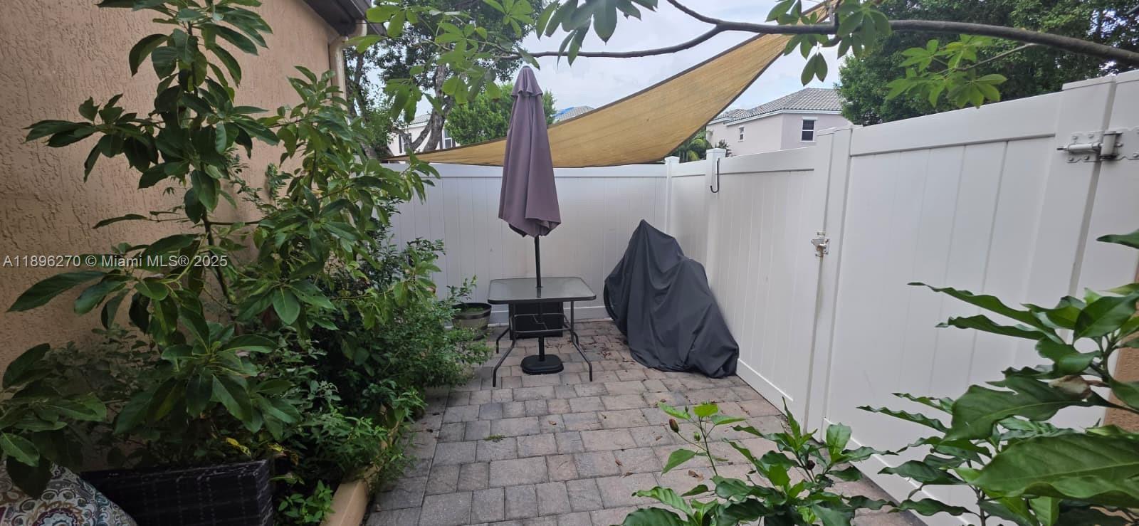 17135 Southwest 96th Street Miami, FL 33196 - Photo 13 of 34 a view of a backyard with potted plants