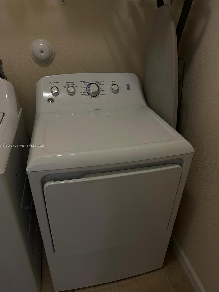 17135 Southwest 96th Street Miami, FL 33196 - Photo 25 of 34 a close up view of washer and dryer
