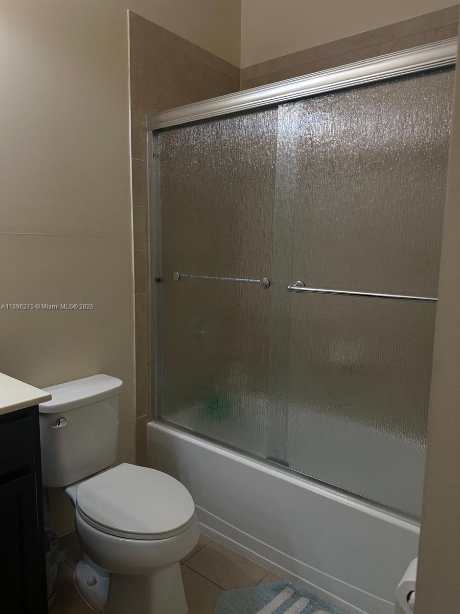 17135 Southwest 96th Street Miami, FL 33196 - Photo 31 of 34 a bathroom with a shower and a toilet