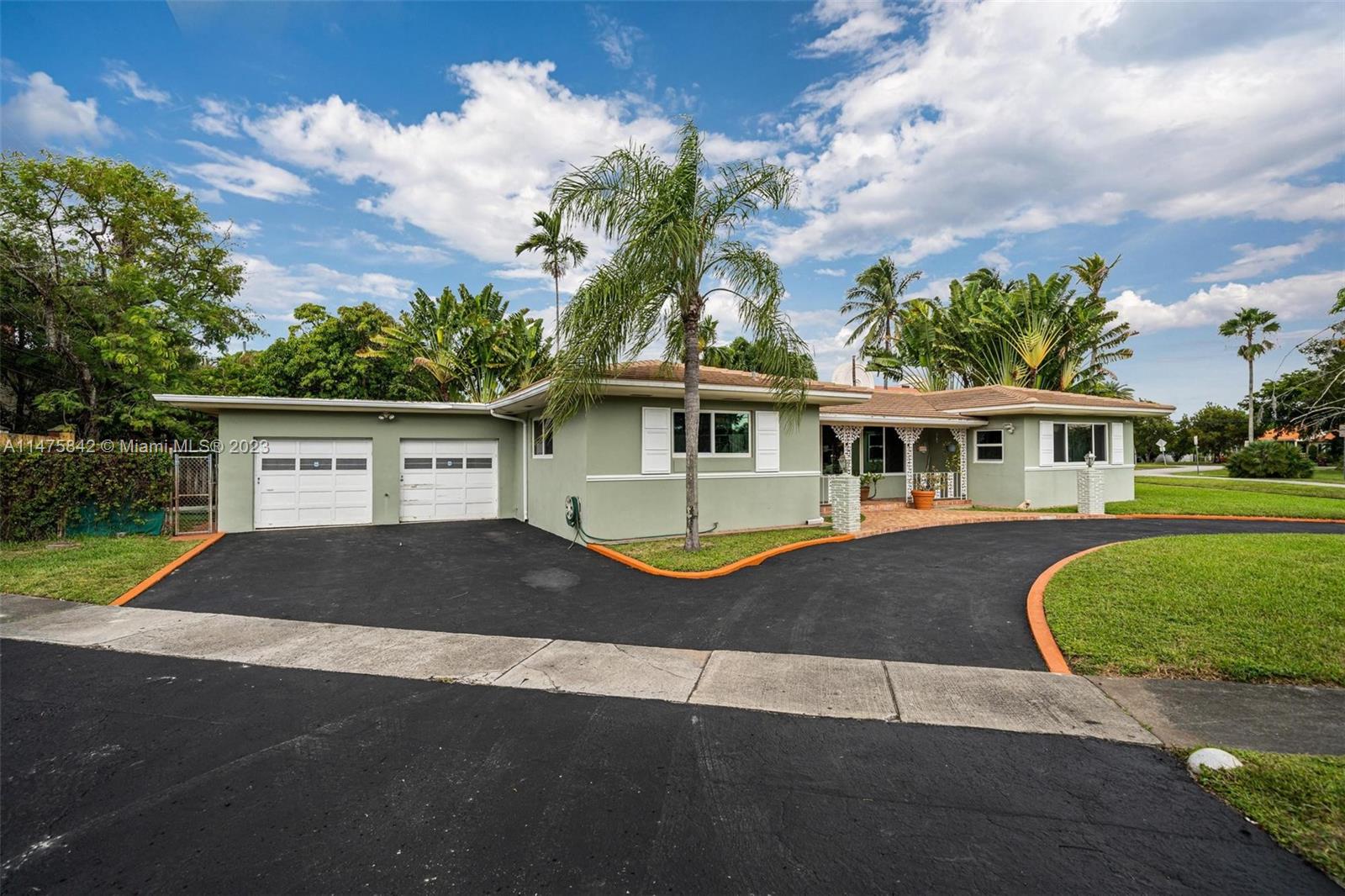 280 Eucalyptus Drive Hialeah, FL 33010 - Photo 1 of 38 a front view of a house with garden
