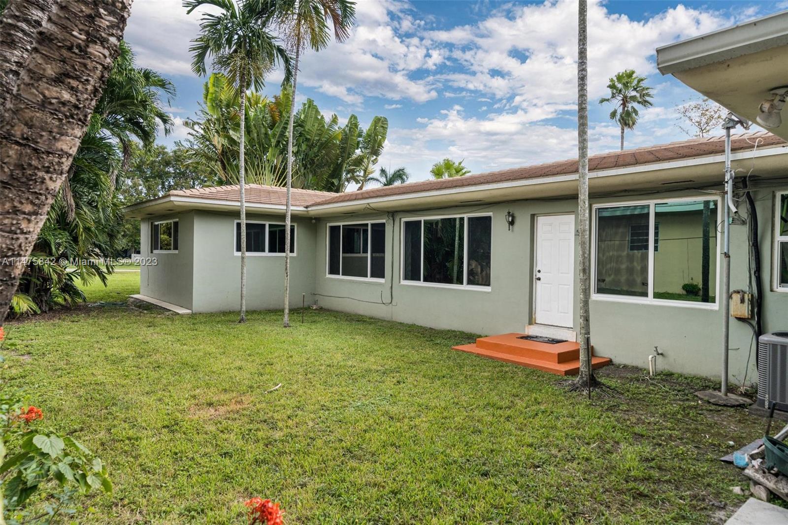 280 Eucalyptus Drive Hialeah, FL 33010 - Photo 11 of 38 a backyard of a house with seating space