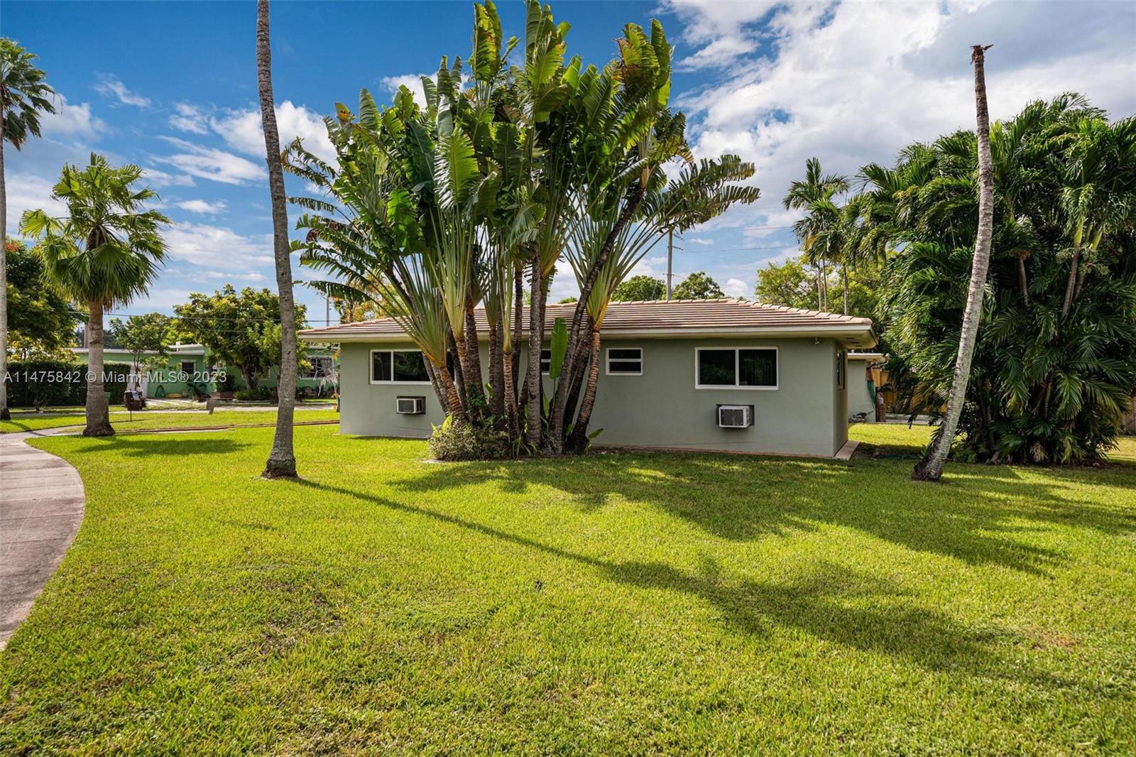 280 Eucalyptus Drive Hialeah, FL 33010 - Photo 12 of 38 a view of a house with pool and trees