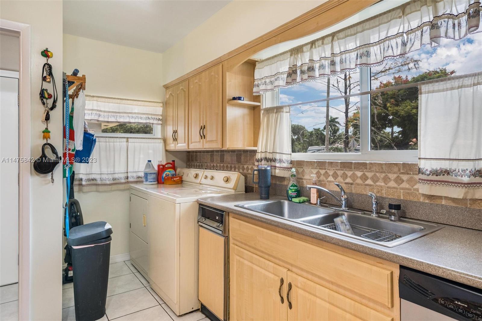 280 Eucalyptus Drive Hialeah, FL 33010 - Photo 20 of 38 a kitchen with a sink and cabinets