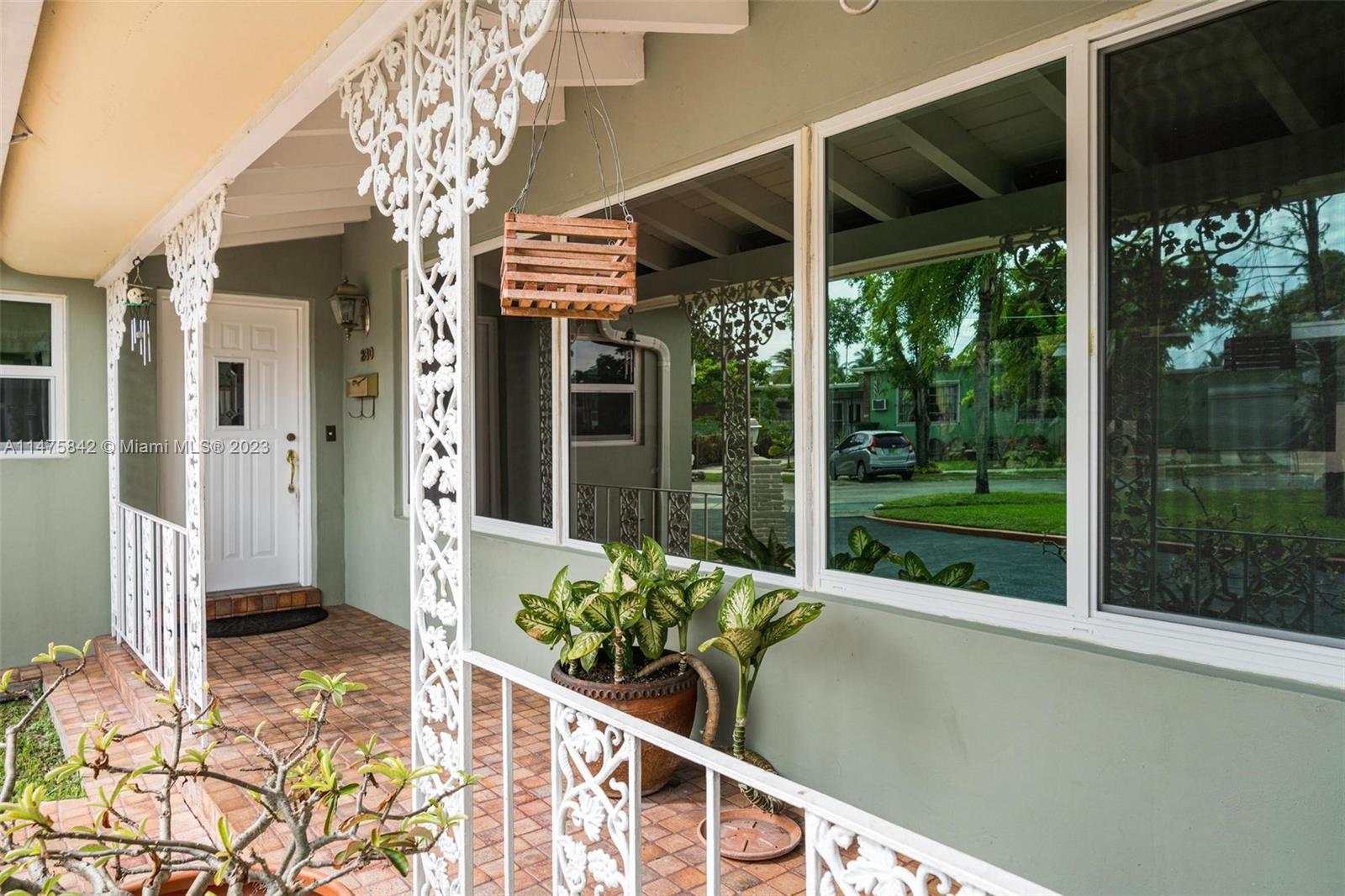 280 Eucalyptus Drive Hialeah, FL 33010 - Photo 2 of 38 a view of a porch with a table and chairs