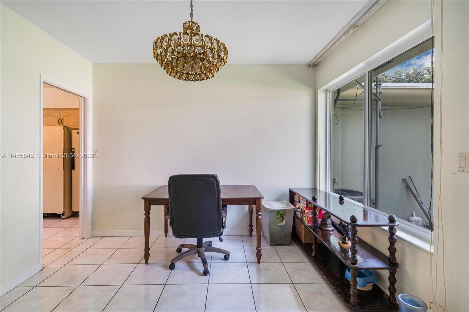 280 Eucalyptus Drive Hialeah, FL 33010 - Photo 21 of 38 a view of a workspace with furniture and a window