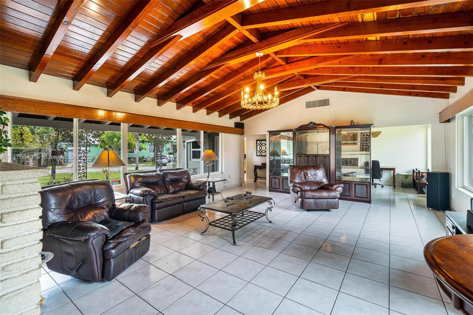 280 Eucalyptus Drive Hialeah, FL 33010 - Photo 23 of 38 a living room with furniture and a large window