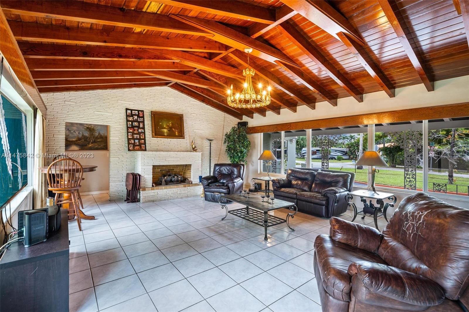 280 Eucalyptus Drive Hialeah, FL 33010 - Photo 24 of 38 a living room with furniture and a fireplace