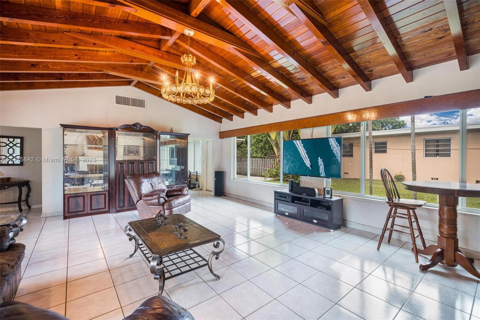 280 Eucalyptus Drive Hialeah, FL 33010 - Photo 25 of 38 a living room with furniture and a large window