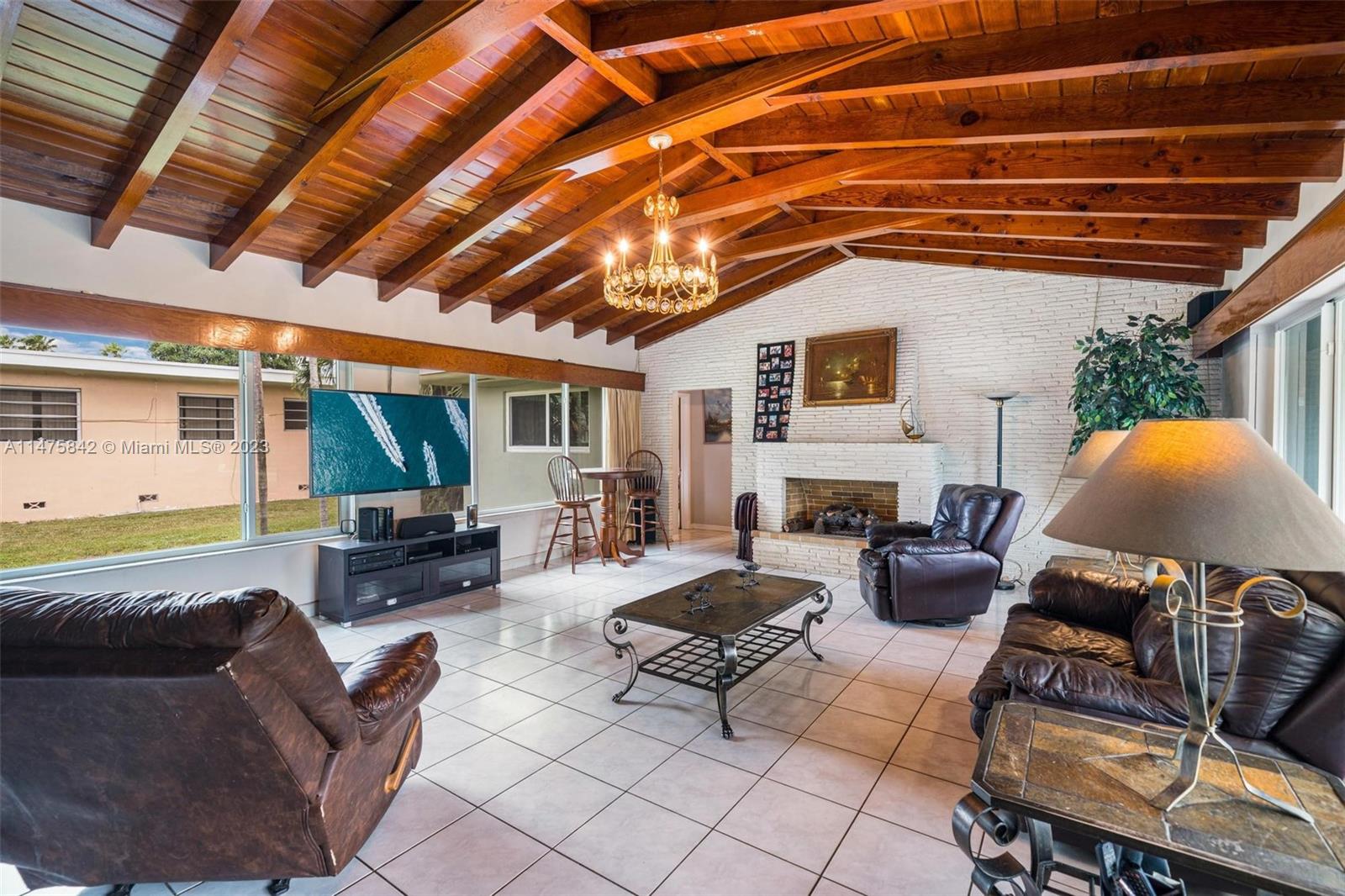 280 Eucalyptus Drive Hialeah, FL 33010 - Photo 26 of 38 a living room with furniture and a fireplace