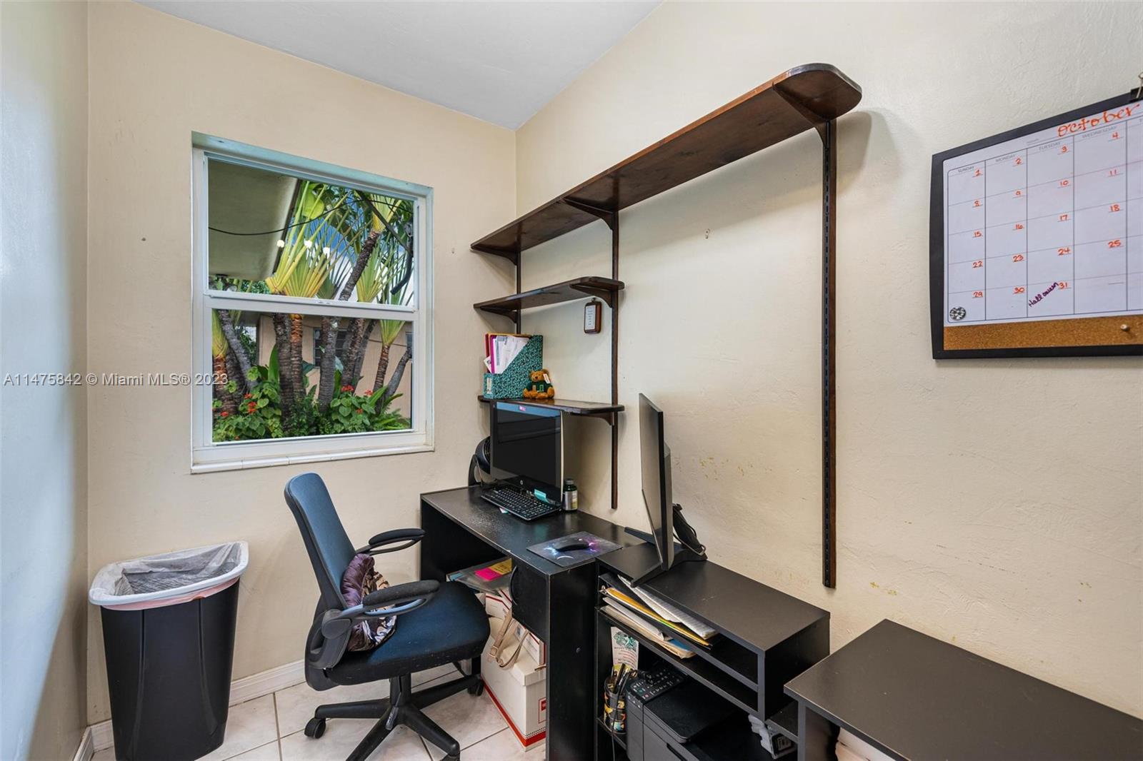 280 Eucalyptus Drive Hialeah, FL 33010 - Photo 27 of 38 a view of a workspace with furniture and a window