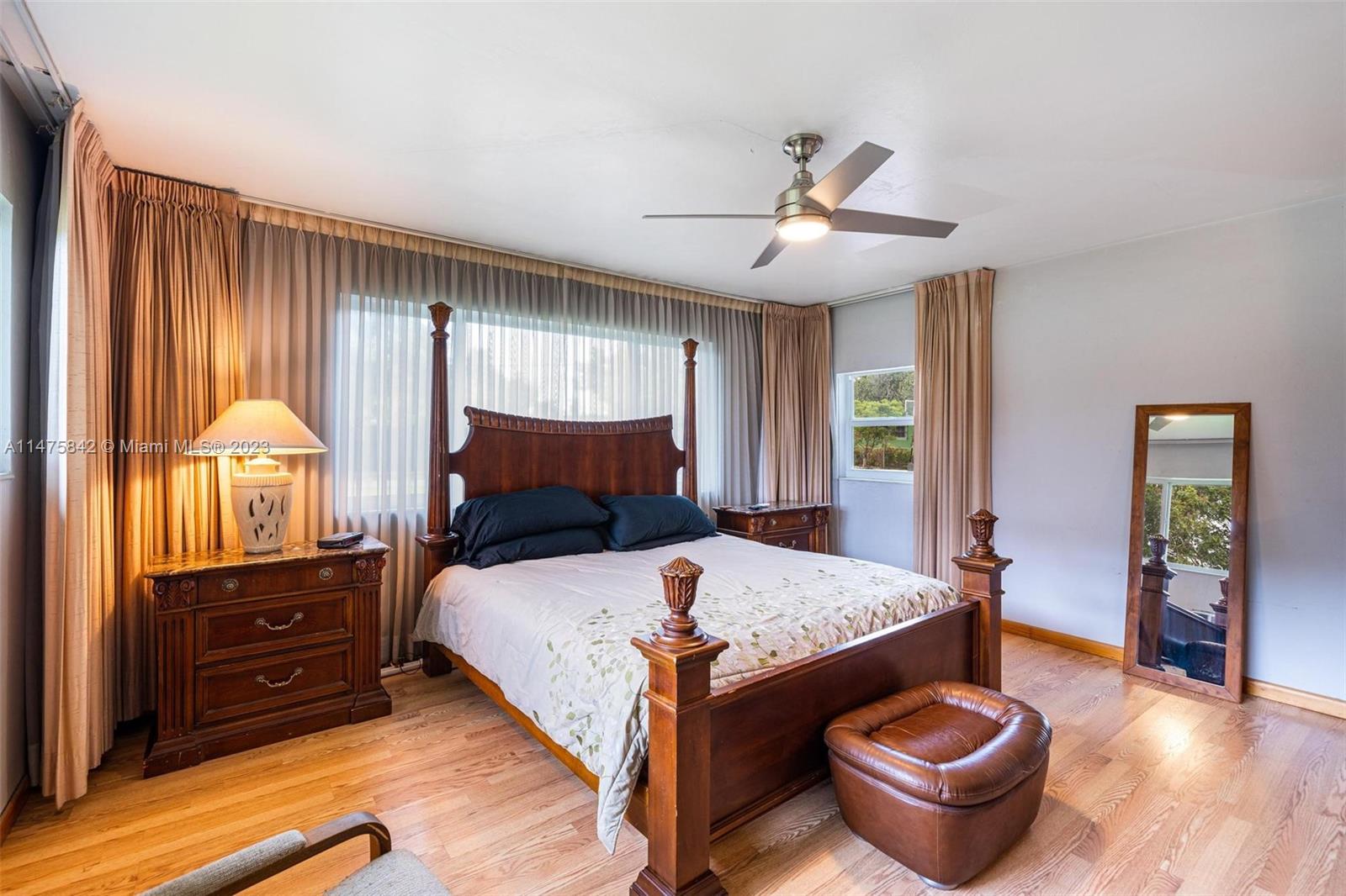 280 Eucalyptus Drive Hialeah, FL 33010 - Photo 29 of 38 a bedroom with a bed and wooden floor