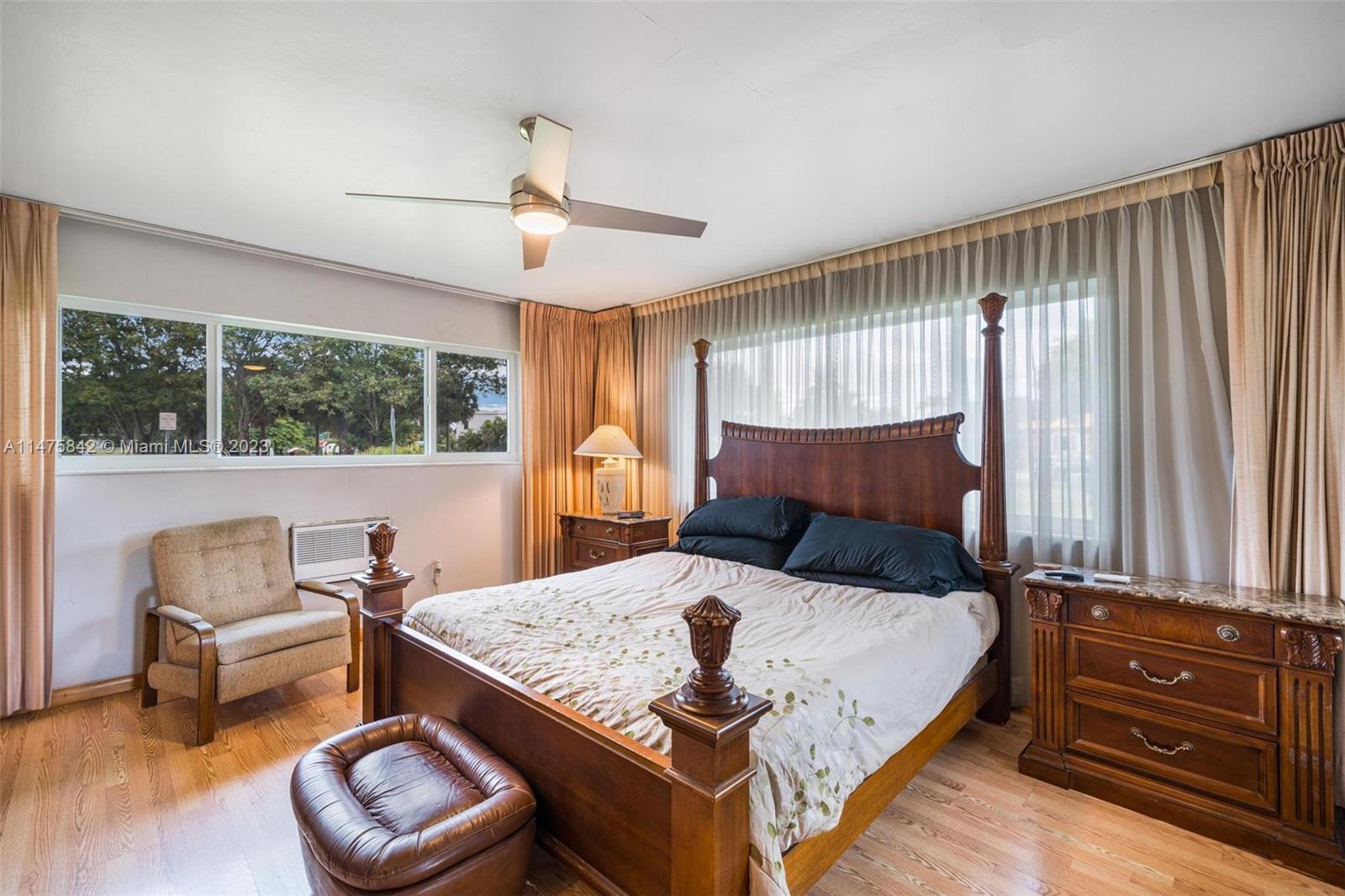 280 Eucalyptus Drive Hialeah, FL 33010 - Photo 30 of 38 a bed room with a bed and a chair