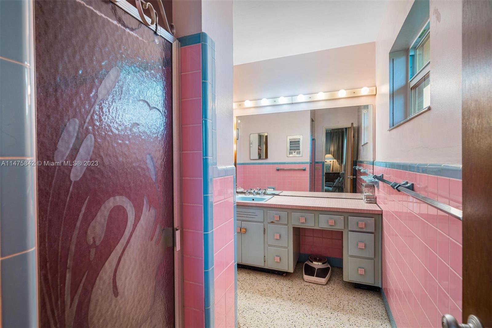 280 Eucalyptus Drive Hialeah, FL 33010 - Photo 32 of 38 a bathroom with a sink mirror and vanity