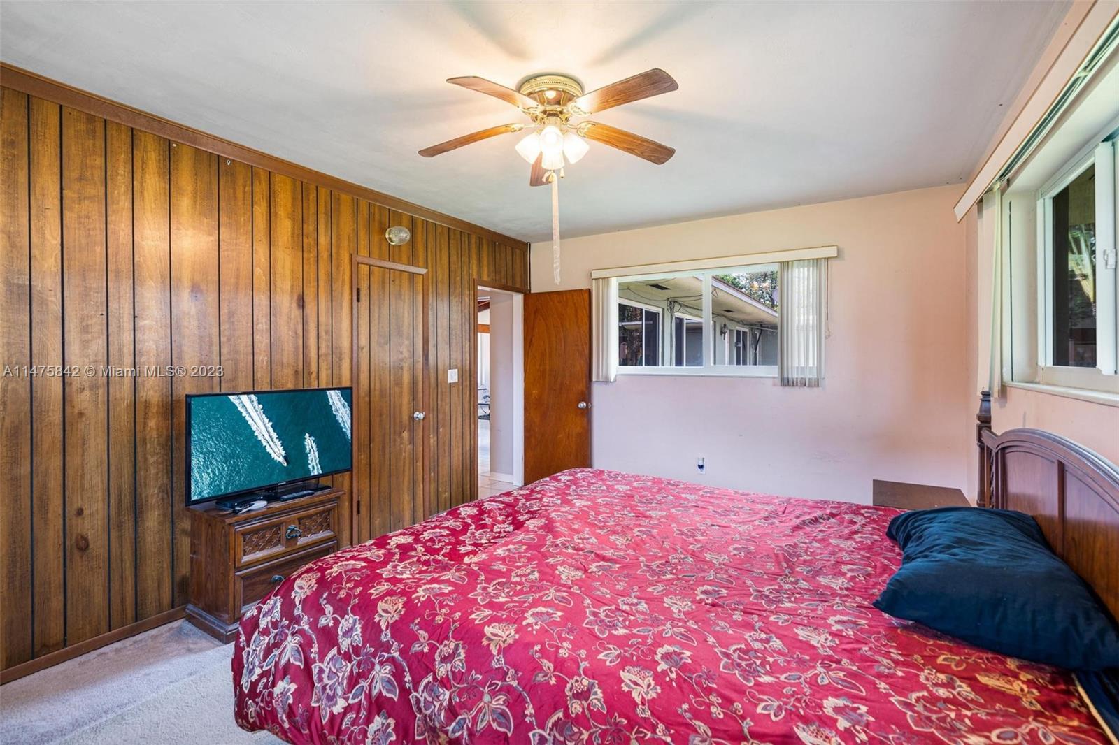 280 Eucalyptus Drive Hialeah, FL 33010 - Photo 34 of 38 a bedroom with a bed and a flat screen tv