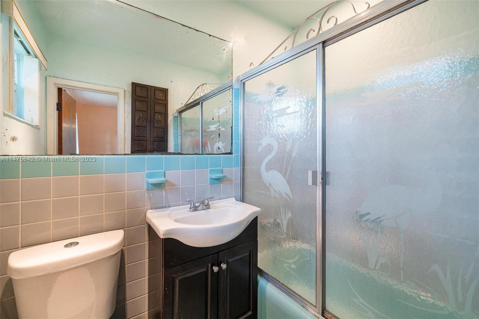 280 Eucalyptus Drive Hialeah, FL 33010 - Photo 35 of 38 a bathroom with a sink a toilet and shower