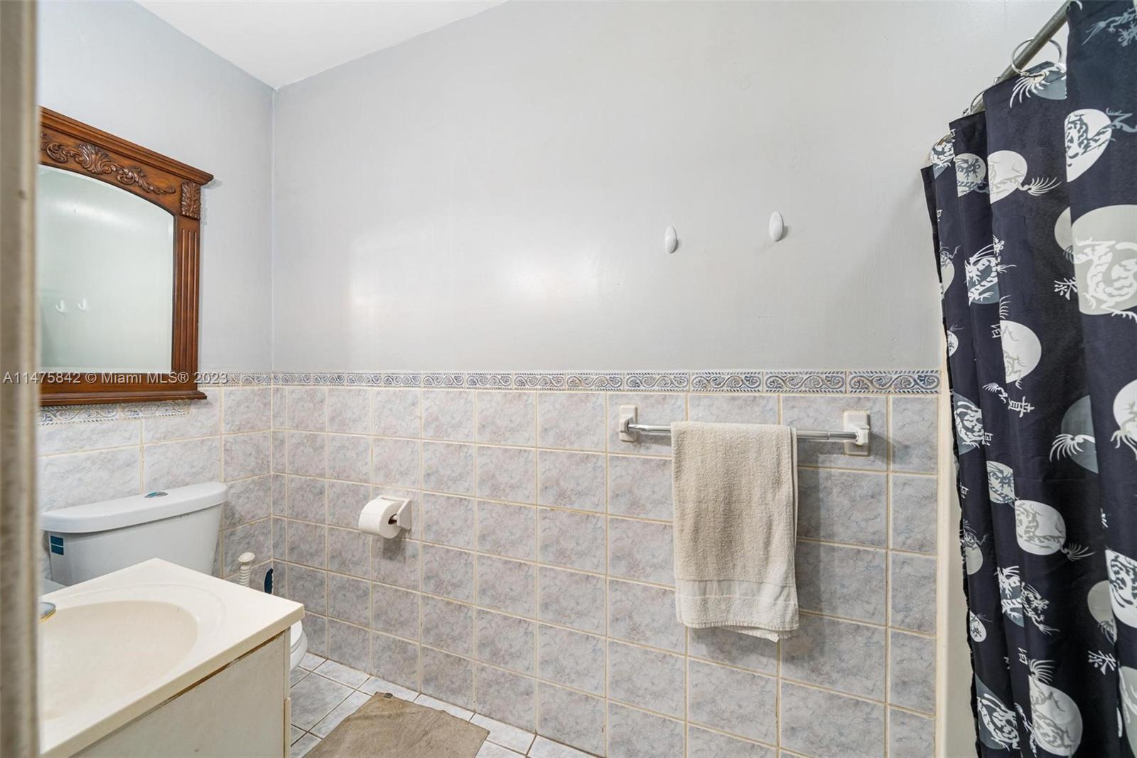 280 Eucalyptus Drive Hialeah, FL 33010 - Photo 37 of 38 a bathroom with a toilet and a shower