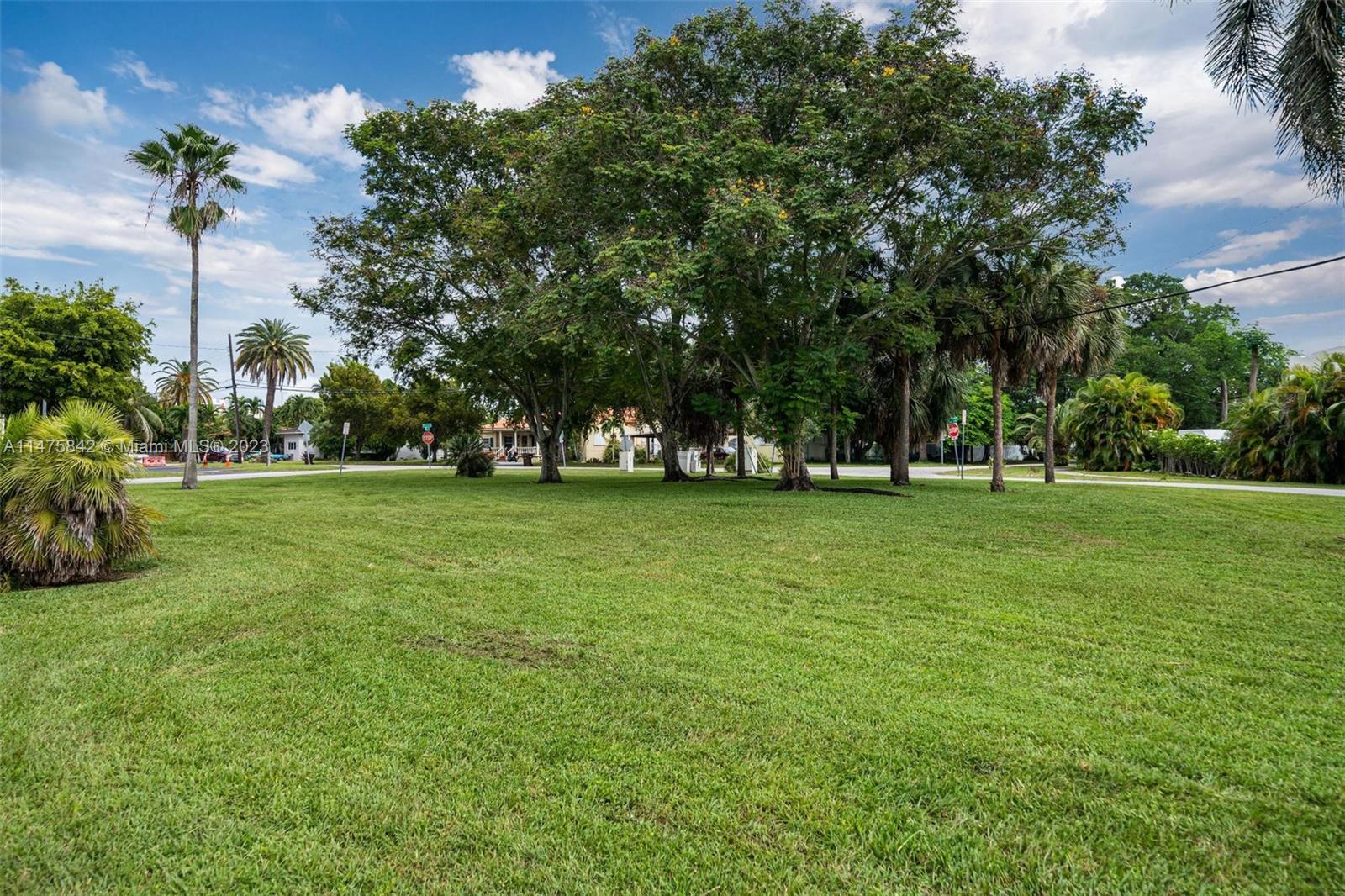 280 Eucalyptus Drive Hialeah, FL 33010 - Photo 38 of 38 a view of grassy field with benches and trees all around