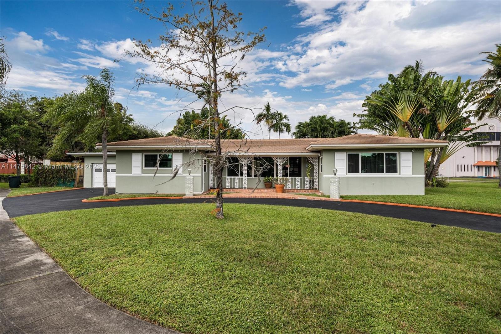 280 Eucalyptus Drive Hialeah, FL 33010 - Photo 6 of 38 front view of a house with a patio